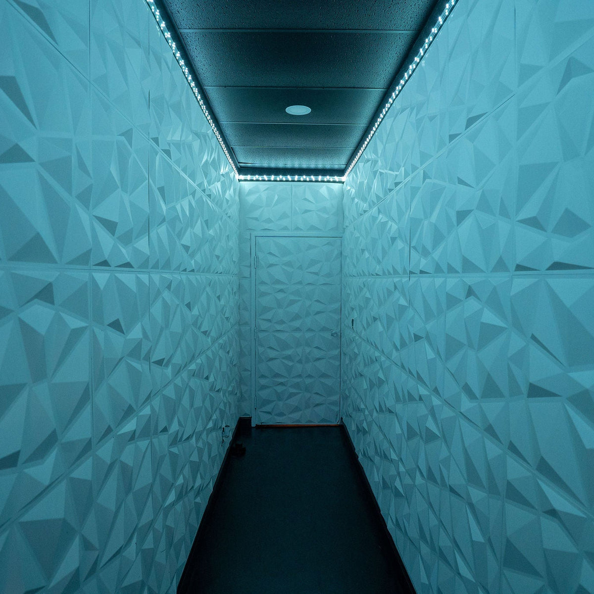 Geometric white hallway with colored lighting
