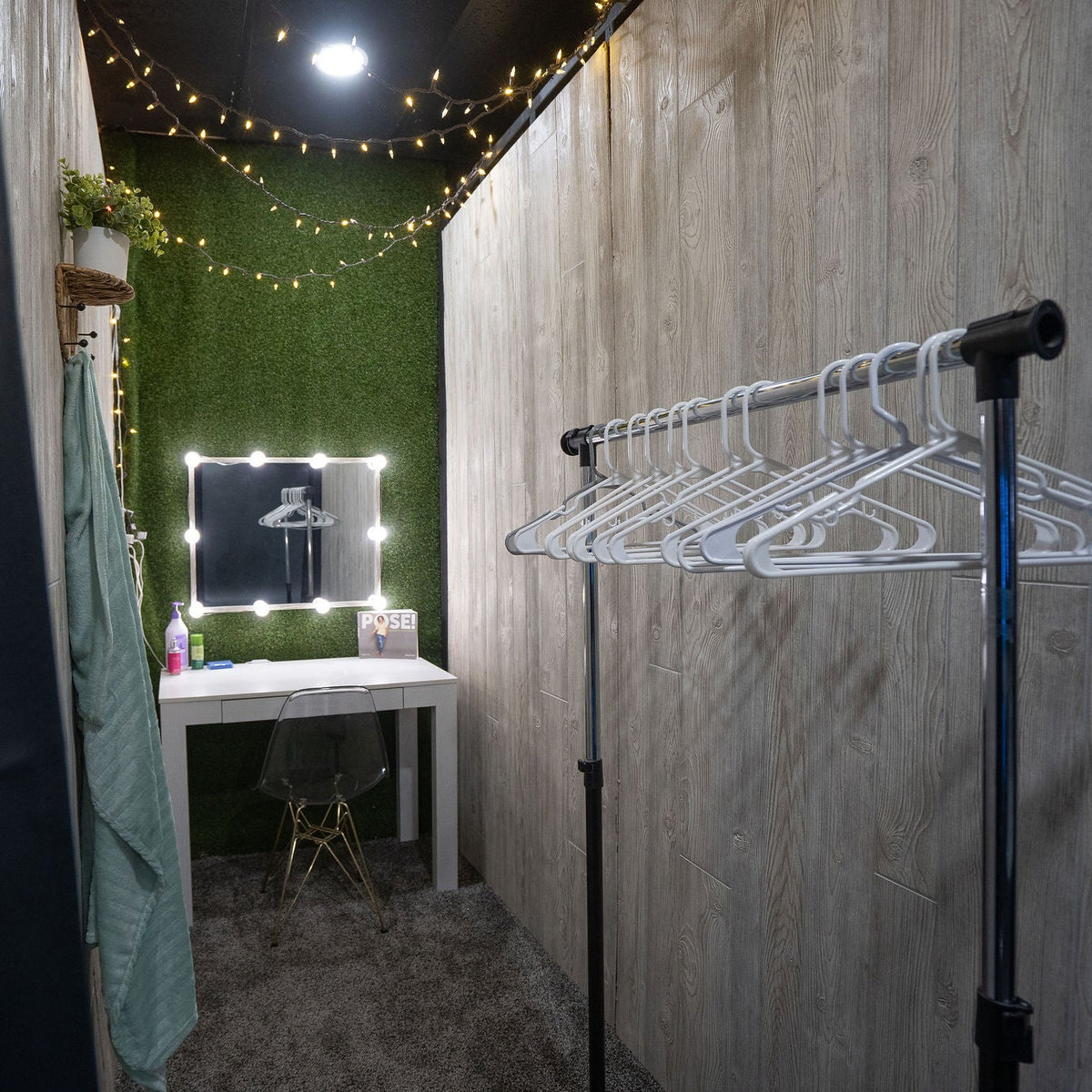 Private changing area with mirror and clothes rail
