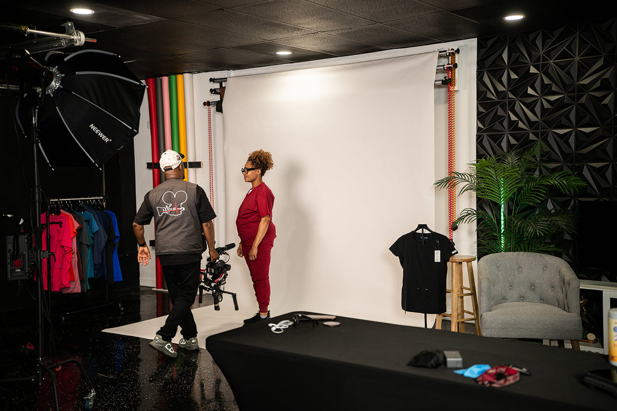 Behind the scenes of a scrubs brand shoot in the Crack House Studios content studio.