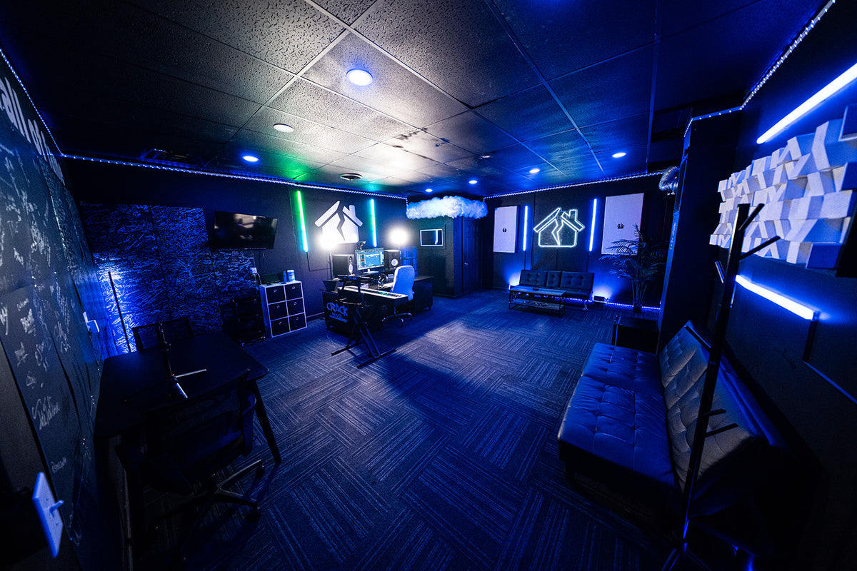 Wide view of the Crack House Studios music recording room with blue lighting