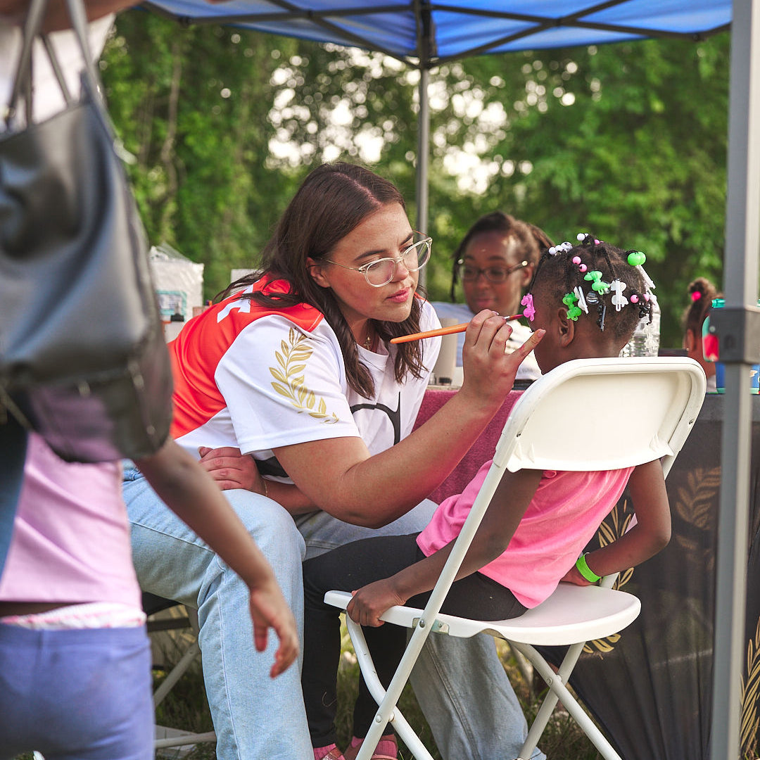 face painting activity photographed during a community event